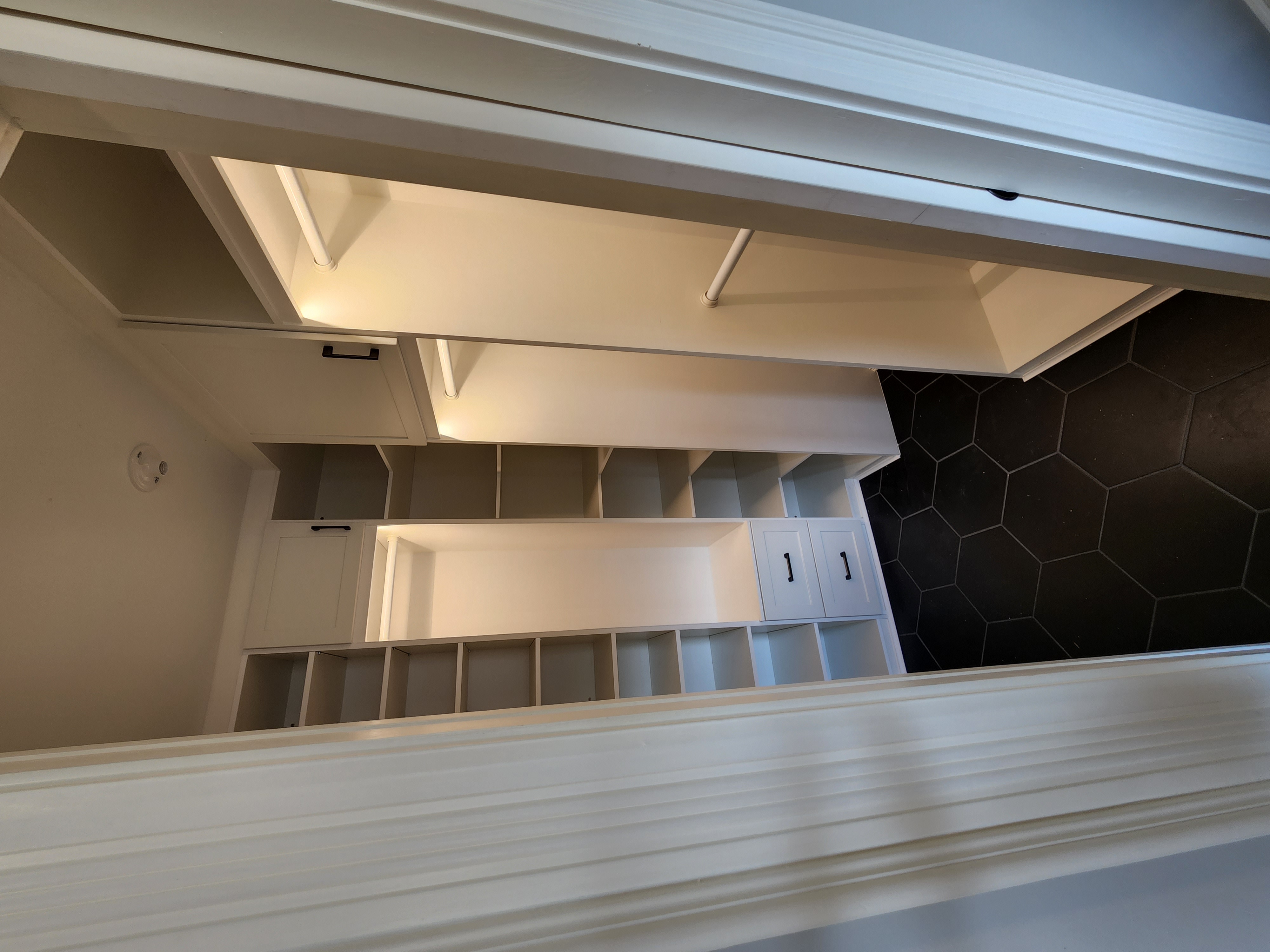 white closet with built in lighting